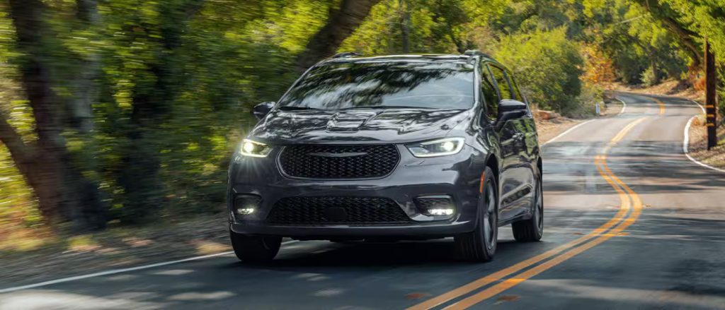 black chrysler pacifica driving